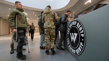 Visitors gather outside PMC Wagner Centre, which is a project implemented by the businessman and founder of the Wagner private military group Yevgeny Prigozhin, during the official opening of the office block in Saint Petersburg, Russia, November 4, 2022. REUTERS/Igor Russak