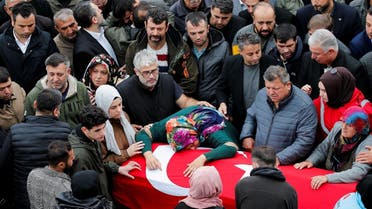 Mourners gather during a funeral ceremony of the mine blast victims in the village of Ahatlar near Amasra, in the northern Bartin province, Turkey, on October 16, 2022. (Reuters)