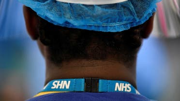 Detail is seen on a lanyard of a nurse on a COVID-19 ward at Milton Keynes University Hospital, amid the spread of the coronavirus disease (COVID-19) pandemic, Milton Keynes, Britain, January 20, 2021. Picture taken January 20, 2021. REUTERS/Toby Melville