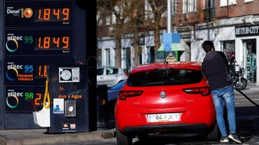 A man fills fuel at a service station during a significant increase in the price of energy in Madrid, Spain, March 8, 2022. REUTERS/Juan Medina