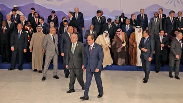 Egypt's President Abdel Fattah al-Sisi (C) and United Nations Secretary General Antonio Guterres walk together after world leaders had their group picture taken ahead of their summit at the COP27 climate conference, in the Egyptian Red Sea resort city of Sharm el-Sheikh, on November 7, 2022. (Photo by AHMAD GHARABLI / AFP)