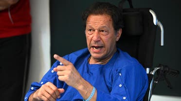 In this picture taken on on November 4, 2022, Pakistan's former prime minister Imran Khan addresses the media representatives at a hospital in Lahore, a day after an assassination attempt on him. (AFP)