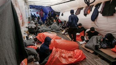 Migrants sleep on deck of NGO rescue ship 'Ocean Viking', in the Mediterranean Sea, November 6, 2022. (Reuters)