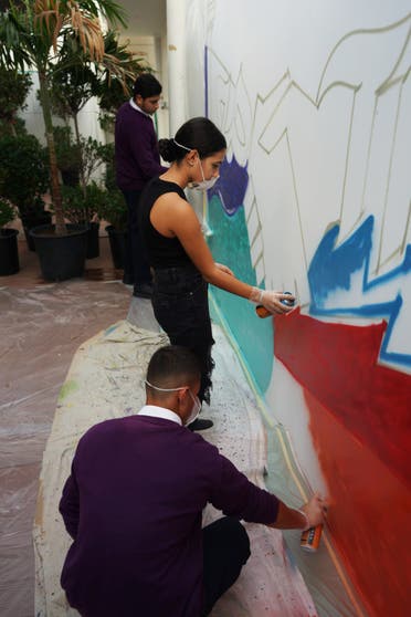 Jewish and Emirati schoolchildren spray paint a mural at the Jewish Educational Campus in Dubai. (Marco Ferrari/Al Arabiya English)