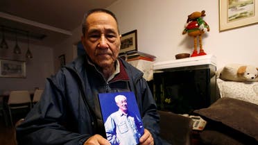 Bao Tong, Zhao Ziyang's former aide, poses with a portrait of Zhao which he has kept in his living room, during an interview with Reuters at his house in Beijing. (Reuters)