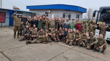 Ukrainian prisoners of war (POWs) pose for a picture after a swap, amid Russia’s attack on Ukraine, in an unknown location, Ukraine November 11, 2022. (Head of Ukraine’s Presidential Office Andriy Yermak via Telegram/Handout via Reuters)
