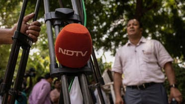 A microphone of New Delhi Television (NDTV) is placed on a tripod along a roadside in New Delhi, India, August 26, 2022. (File photo: Reuters)
