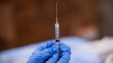 A syringe is filled with a dose of Pfizer's coronavirus disease (COVID-19) vaccine at a pop-up community vaccination center in Valley Stream, New York. (Reuters)