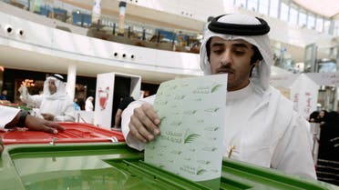 A voter casts his vote during parliamentary elections, at a polling station set up at the Seef Mall shopping centre in Manama November 22, 2014. (File photo: Reuters)