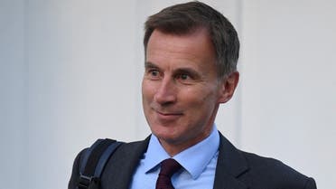 Britain’s Chancellor of the Exchequer Jeremy Hunt walks outside his house in London, Britain, on October 18, 2022. (Reuters)