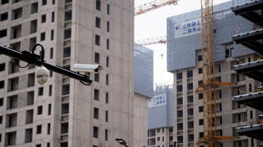 Surveillance cameras are seen near residential buildings under construction in Shanghai, China, on July 20, 2022. (Reuters)