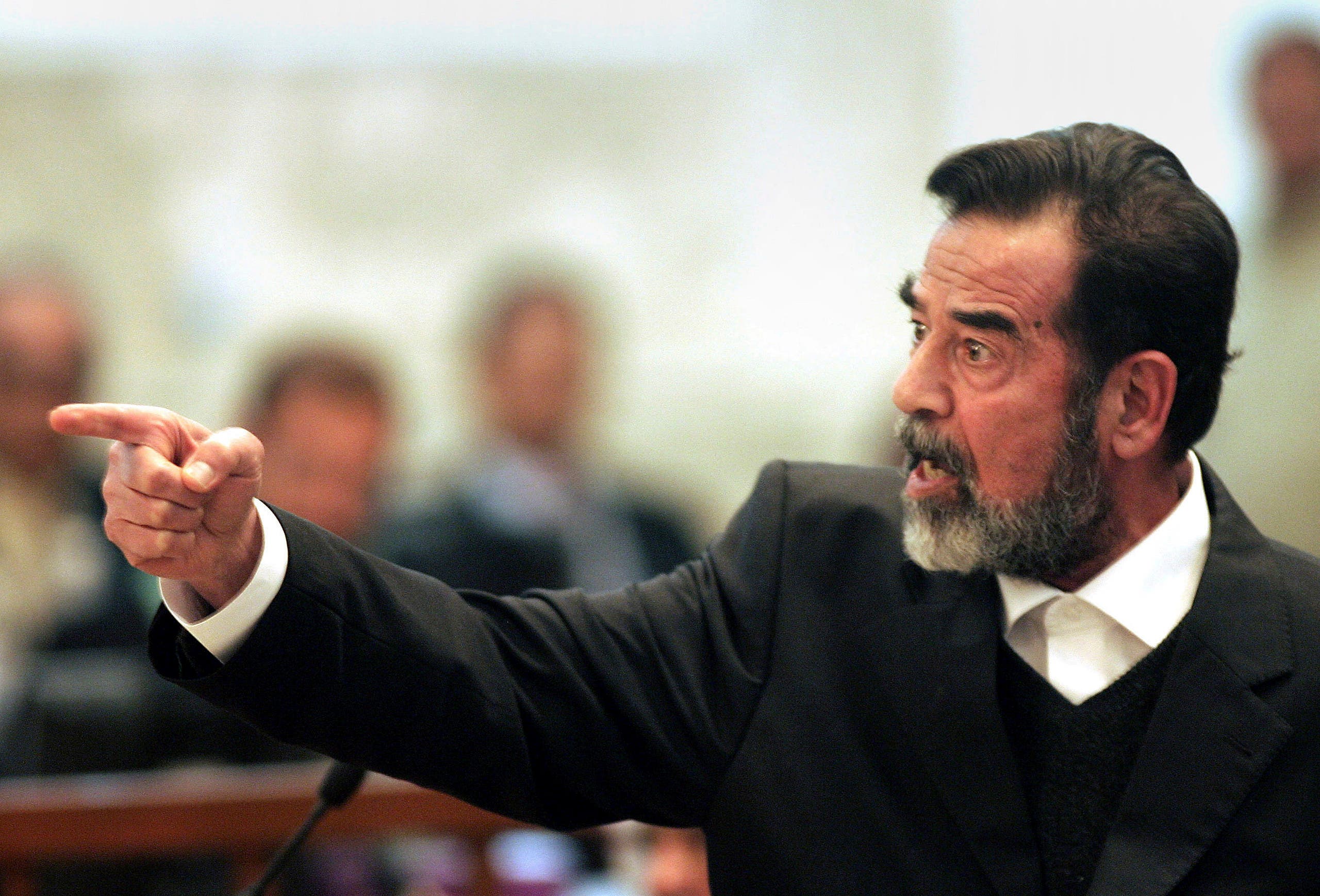 صدام حسين أثناء محاكمته - وكالات