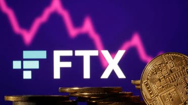 Representations of cryptocurrencies are seen in front of displayed FTX logo and decreasing stock graph in this illustration taken November 10, 2022. (File Photo: Reuters)