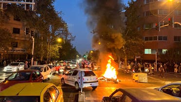 A police motorcycle burns during a protest over the death of Mahsa Amini, a woman who died after being arrested by the Islamic republic's morality police, in Tehran, Iran September 19, 2022. (File photo: Reuters)