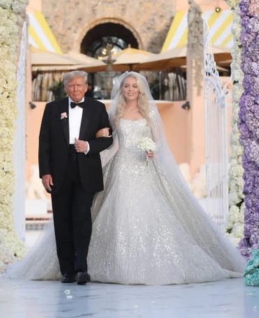 Donald Trump walks his daughter Tiffany Trump down the isle at her wedding with Michael Boulos. (Twitter)