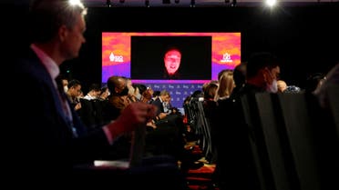 2022-11-Elon Musk, Tesla Inc. CEO, is seen on the screen as he speaks virtually during the B20 Summit, ahead of the G20 leaders' summit, in Nusa Dua, Bali, Indonesia, November 14, 2022. (Reuters)-SUMMIT-BUSINESS