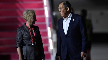 Russian Foreign Minister Sergey Lavrov, right, talks to Russian Ambassador to Indonesia Lyudmila Vorobyova upon his arrival to attend the G20 Summit at Ngurah Rai International Airport in Bali, Indonesia, Sunday, Nov. 13, 2022. (Sonny Tumbelaka/Pool photo via AP)