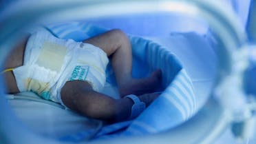 A newborn baby sits inside an incubator in the nursery of Santo Spirito Hospital, in Rome, Italy, on November 14, 2022. (Reuters)