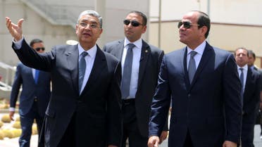 Egyptian President Abdel Fattah Al Sisi (R) walks with Egypt's Electricity Minister Mohamed Shaker during the inauguration of major power stations in the energy sector as part of the country's development drive, at Egypt's new administrative capital, north of Cairo, Egypt, July 24, 2018 in this handout picture courtesy of the Egyptian Presidency. (File photo: Reuters)