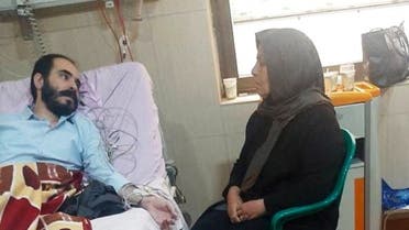 Iranian activist and blogger Hossein Ronaghi is treated in a hospital in Tehran. (Reuters)