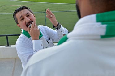 Saudi national football team fan and the head of the fan association for the prestigious Jeddah-based Saudi club Al-Ahly, Bader Turkistani, poses for a picture on November 9, 2022 in the Saudi Red Sea city of Jeddah. (AFP)