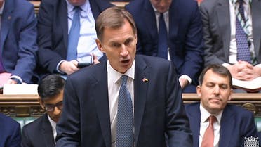A video grab from footage broadcast by the UK Parliament's Parliamentary Recording Unit (PRU) shows Britain's Chancellor of the Exchequer Jeremy Hunt making an autumn budget statement in the House of Commons in London on November 17, 2022. (AFP)