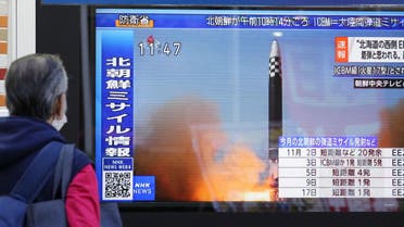 A passerby looks at a television screen showing a news report about North Korea firing a ballistic missile in Tokyo, Japan November 18, 2022. Mandatory credit Kyodo via REUTERS ATTENTION EDITORS - THIS IMAGE WAS PROVIDED BY A THIRD PARTY. MANDATORY CREDIT. JAPAN OUT. NO COMMERCIAL OR EDITORIAL SALES IN JAPAN
