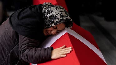A relative of Yagmur Ucar and Arzu Ozsoy, a mother and daughter, who are two of the six victims of Sunday's blast that took place on Istiklal Avenue, mourns during their funeral ceremony in Istanbul, Turkey, November 14, 2022. REUTERS/Umit Bektas TPX IMAGES OF THE DAY