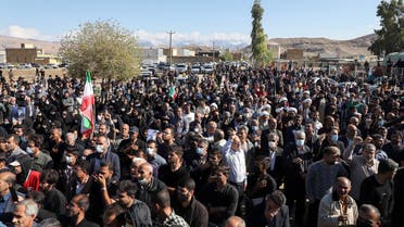 Iranians carry the coffin of one of the people killed in a shooting attack, during their funeral in the city of Izeh in Iran's Khuzestan province, on November 18, 2022. In some of the worst violence since the protests erupted, assailants on motorbikes shot dead seven people, including a woman and two children aged nine and 13, at a central market of Izeh on the evening of November 16, 2022, state media said. (Photo by ALIREZA MOHAMMADI / ISNA / AFP)
