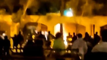 This image grab from a UGC video posted on November 17, 2022, reportedly shows Iranian protesters starting a fire at the family home of the founder of the Islamic republic Ayatollah Ruhollah Khomeini, now a museum, in the central Iranian city of Khomein. (AFP)