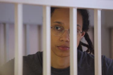 U.S. basketball player Brittney Griner, who was detained at Moscow's Sheremetyevo airport and later charged with illegal possession of cannabis, stands inside a defendants' cage during the reading of the court's verdict in Khimki outside Moscow, Russia August 4, 2022. REUTERS/Evgenia Novozhenina/Pool/File Photo