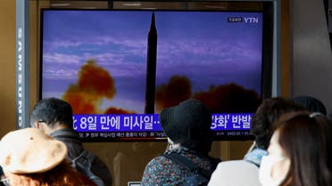 A man walks past a TV broadcasting a news report, on North Korea firing a ballistic missile off its east coast, in Seoul, South Korea, November 17, 2022. REUTERS/Heo Ran