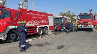 A handout picture provided by the Kuwait National Petroleum Company (KNPC) on October 18, 2021 shows firefighters arriving to put out a fire at the Mina al-Ahmadi facility, about 40 kilometres (25 miles) south of the capital Kuwait City. (File photo: AFP)
