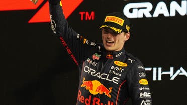 Red Bull's Max Verstappen celebrates with a trophy on the podium after winning the Abu Dhabi Grand Prix. (Reuters)