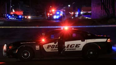 A police officer sits in their vehicle while responding to a mass shooting at the Club Q gay nightclub in Colorado Springs, Colorado, U.S., November 20, 2022. (Reuters)