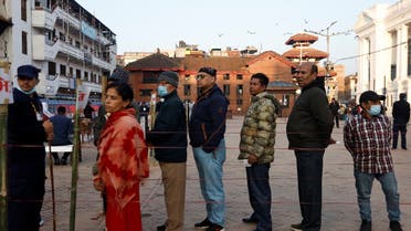 People stand in a queue to cast their votes during the general election, in Kathmandu, Nepal, on November 20, 2022. (Reuters)