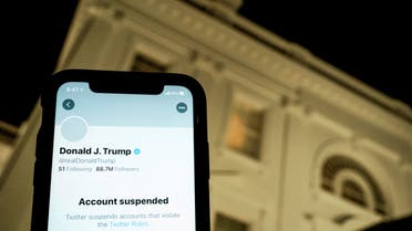A photo illustration shows the suspended Twitter account of former US president Donald Trump on a smartphone and a lit window in the White House residence in Washington, US, January 8, 2021. (File photo: Reuters) 