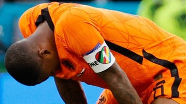Netherlands' midfielder Georginio Wijnaldum wearing a captain's armband bearing the words One Love and a rainbow motif reacts at the end of the UEFA EURO 2020 round of 16 football match between the Netherlands and the Czech Republic at Puskas Arena in Budapest on June 27, 2021. (AFP)