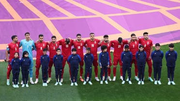 Iran players refuse to sing the national anthem before their match against England. (Reuters) 