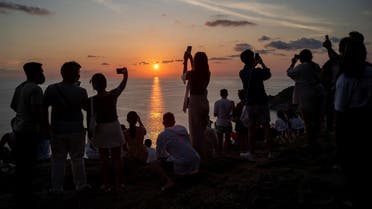 Locals and tourists watch a sunset from Phuket Island’s Phromthep Cape, Thailand. (File photo: Reuters)