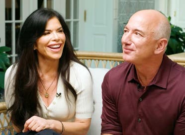 Jeff Bezos, with his girlfriend, Lauren Sanchez, during a CNN interview