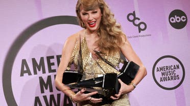Taylor Swift poses with the Artist of the Year, Favourite Music Video, Favourite Female Pop Artist, Favourite Pop Album, Favourite Female Country Artist, Favourite Country Album award in the press room during the 2022 American Music Awards at the Microsoft Theater in Los Angeles, California, U.S., November 20, 2022. (Reuters)