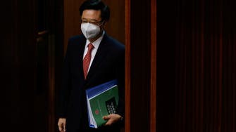 Hong Kong leader tests positive for COVID-19 on return from APEC summit 