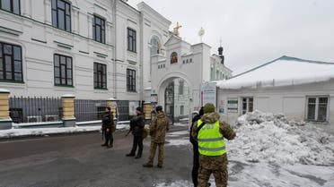 Ukrainian law enforcement officers stand next to an entrance to the Kyiv Pechersk Lavra monastery compound, amid Russia's attack on Ukraine, in Kyiv, Ukraine November 22, 2022. (Reuters)