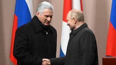 Cuban President Miguel Diaz-Canel shakes hands with Russian President Vladimir Putin during an unveiling ceremony of a monument to late Cuban leader Fidel Castro in Moscow, Russia November 22, 2022. (Reuters)
