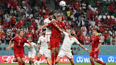 Denmark’s forward #21 Andreas Cornelius heads the ball during the Qatar 2022 World Cup Group D football match between Denmark and Tunisia at the Education City Stadium in Al-Rayyan, west of Doha on November 22, 2022. (AFP)