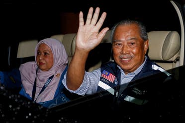 Malaysian former Prime Minister and Perikatan Nasional Chairman Muhyiddin Yassin waves as he leaves after Malaysia's 15th general election in Shah Alam, Malaysia, on November 22, 2022. (Reuters)              