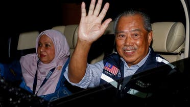 Malaysian former Prime Minister and Perikatan Nasional Chairman Muhyiddin Yassin waves as he leaves after Malaysia's 15th general election in Shah Alam, Malaysia, on November 22, 2022. (Reuters)              