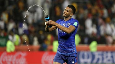 Al Hilal's defender Ali al-Bulaihi sprinkles water as he celebrates his team's victory after the 2019 FIFA Club World Cup quarter-final football match between Hilal and Esperance de Tunis at Jassim Bin Hamad Stadium in Doha on December 14, 2019. (AFP)