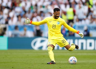 Saudi Arabia goalkeeper Mohammed al-Owais plays the ball against Argentina during a group stage match during the 2022 World Cup at Lusail Stadium. (Reuters)
